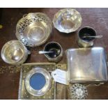 A collection of hallmarked silver to include a cigarette case, dishes, condiments etc