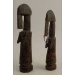 A pair of Cote D'Ivoire Senufo carved wooden diviners statuettes, heights 8.75ins and 7.5ins