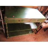 A painted green buffet, raised on turned supports, with painted gilt decoration, and two drawers,
