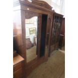 An Edwardian mirror door wardrobe, with carved decoration, width 47ins x height 83ins, together with