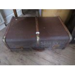 A wood and metal bound suitcase, 27ins x 17ins x 9.5ins