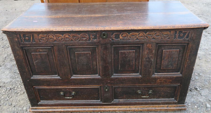 An Antique oak mule chest, with panelled front over one long drawer, 50ins x 22ins, height 30ins