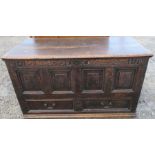 An Antique oak mule chest, with panelled front over one long drawer, 50ins x 22ins, height 30ins