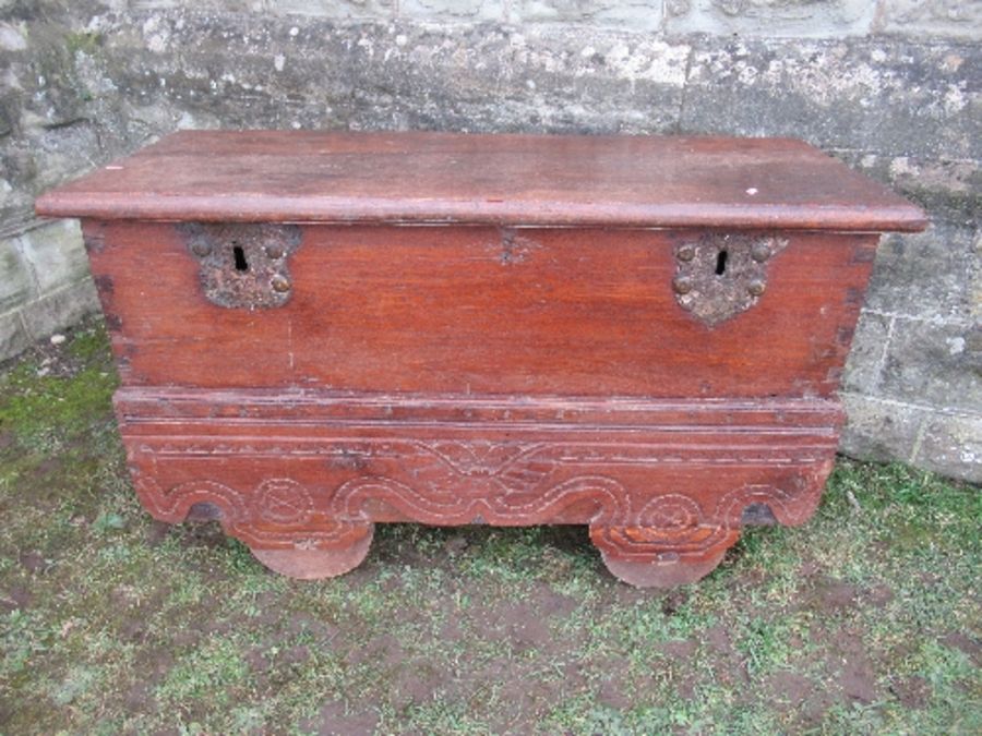 A 19th century hardwood Indonesian dowry chest, with two escutcheons and locking plates, having a