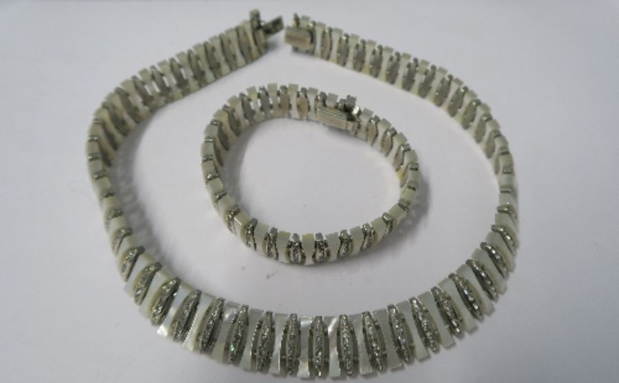 A paste and faux mother of pearl necklace and bracelet, together with pair of clip earrings, cased - Image 2 of 2