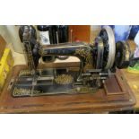 A J Shoolbred & Co cased sewing machine, with gilt decoration and inlaid case