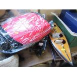 A collection of fishing items, to include reels, two buoyancy aids, model boat, Shakespeare reel,
