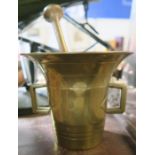 An Antique brass pestle and mortar