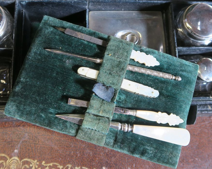 A leather covered Pearce case, the interior fitted with a mother of pearl manicure set, brushes, - Image 5 of 5