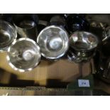 Two boxes of assorted items, to include stainless steel serving items, ceramic pigs etc