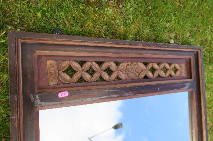 An Eastern design  mirror, with carved fret decoration to the top, 31ins x 23ins - Image 2 of 3