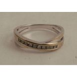 A diamond half hoop ring, finger size N, 2.3g gross