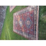 An Eastern design rug, 73ins x 105ins