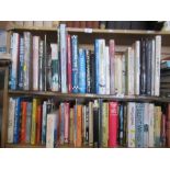 Two shelves of books, relating to motor racing, Jaguar cars, Battle of Britain, etc.