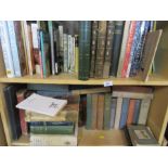 Two shelves of hardback books, to include travel, car related, Beatrix Potter, etc.