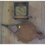 An oak cased mantel clock, with brass dial, height 7.5ins, together with a pair of oak bellows