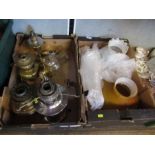 Two boxes of oil lamps, to include chimneys, shades, etc.