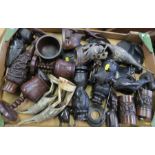 A box of tribal and wooden items, to include goblets, carved horn birds, figures, condiments, etc.