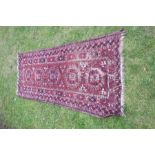 An Eastern design rug, 37ins x 84ins