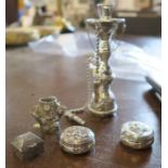 A white metal model, of a Hookah pipe, together with three pill boxes and a model of a stump