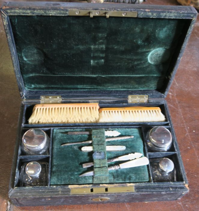 A leather covered Pearce case, the interior fitted with a mother of pearl manicure set, brushes, - Image 2 of 5