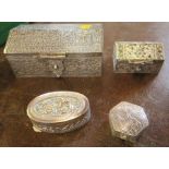 Four white metal boxes, with Eastern style decoration