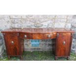 A 19th century mahogany break bow front pedestal sideboard, with gilt rails to the back, fitted with