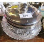 A silver mounted dressing table jar, with cut glass base