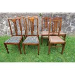 A set of four Edwardian chairs, with inlaid decoration, together with three chairs