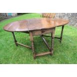 An antique oak gate leg dining table, width 62ins x length 48ins x height 29ins