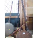 Three warming pans, and a pair of bellows