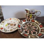 A Royal Crown Derby saucer dish, and cream jug, in the 1128 Imari pattern, and one other