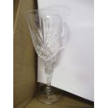 A box of cut glass wine goblets