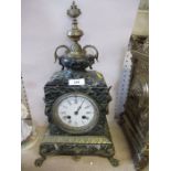 A green marble and gilt metal mantle clock, surmounted by a finial