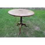 A 19th century oak tripod table, diameter 30.5ins x height 28ins