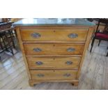 An Edwardian mahogany chest of drawers, with cross banded decoration, having four graduated drawers,