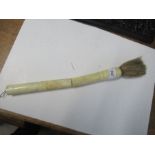 An Antique Chinese calligraphy brush with engraved bone handle