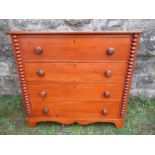 A Victorian / Edwardian chest of four graduated long drawers, with turned bobbin decoration, width
