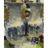 A pair of large vases, decorated in blue and white with buildings in landscape, af, height 22ins