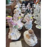 A collection of 8 various Royal Worcester figures