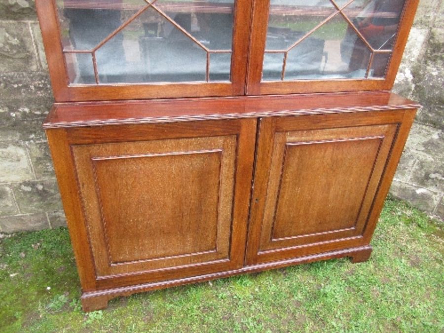 A 19th century glazed cabinet, with astragal glazed doors to top section, over two cupboard doors, - Image 3 of 4