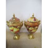 Two Coalport covered vases, decorated with fruit