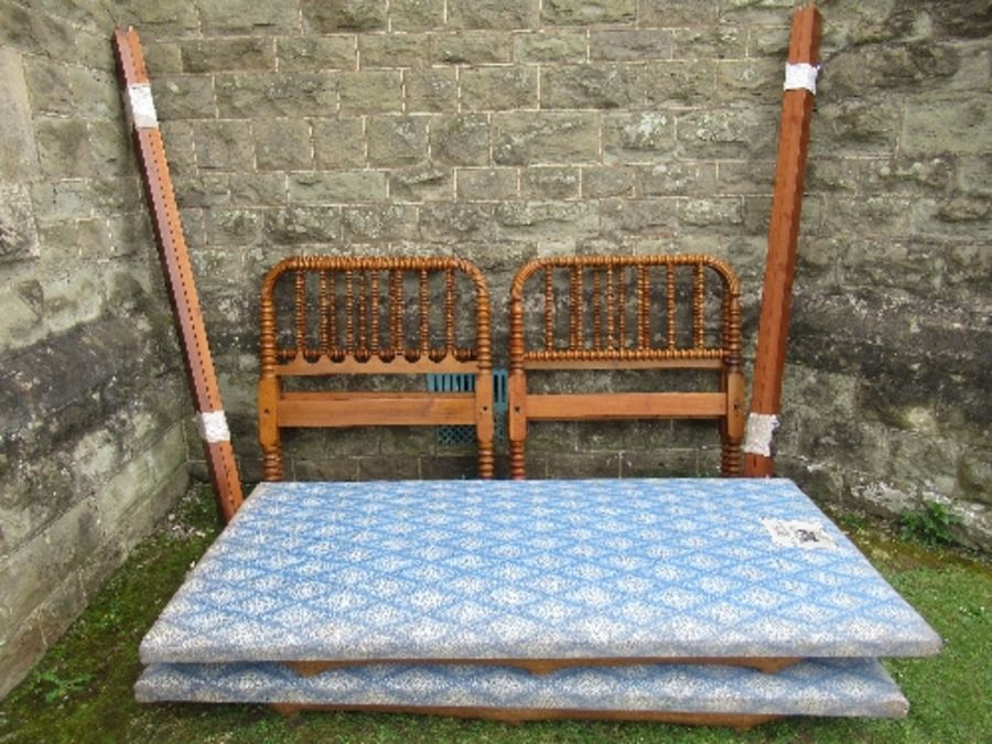 A pair of single beds, with bobbin  decoration all over, width 38ins x height 41ins x  length 80ins,