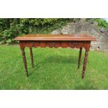 An oak serving table, fitted with three short drawers, raised on turned legs, width 46ins x depth