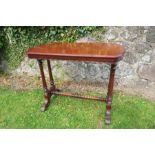 A mahogany centre table, raised on turned legs, united by a stretcher, 36ins x 21ins x height 29ins