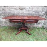 A mahogany sofa table, raised on square supports, terminating in four outswept feet, width 57ins x