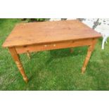 A pine kitchen table, 28ins x 49ins x height 29ins
