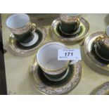 Six Spode green and gilt coffee cans and saucers