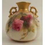 A Royal Worcester twin handled quarter lobed vase, decorated with roses by Fildes, height 5ins