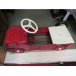 A “Mobo” pedal car / truck in red,  30” x 12”, having swing pedals and solid rubber tyres